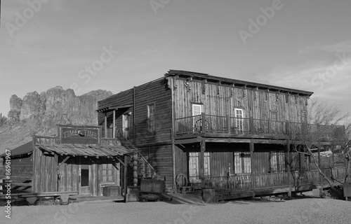 Old Wild West Cowboy town mountains in background in black and white