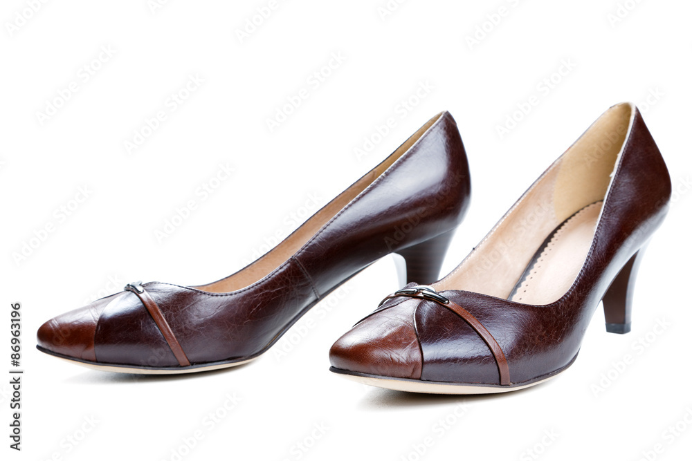 Fototapeta premium Brown female shoes isolated on a white background
