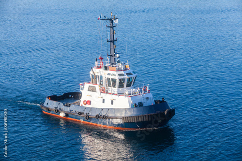 Tug boat underway on sea water