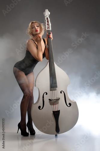 Young Woman In Lingerie With A Double Bass
