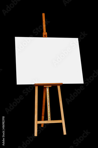 Wooden Easel with Blank Painting Canvas Isolated on Black Backgr
