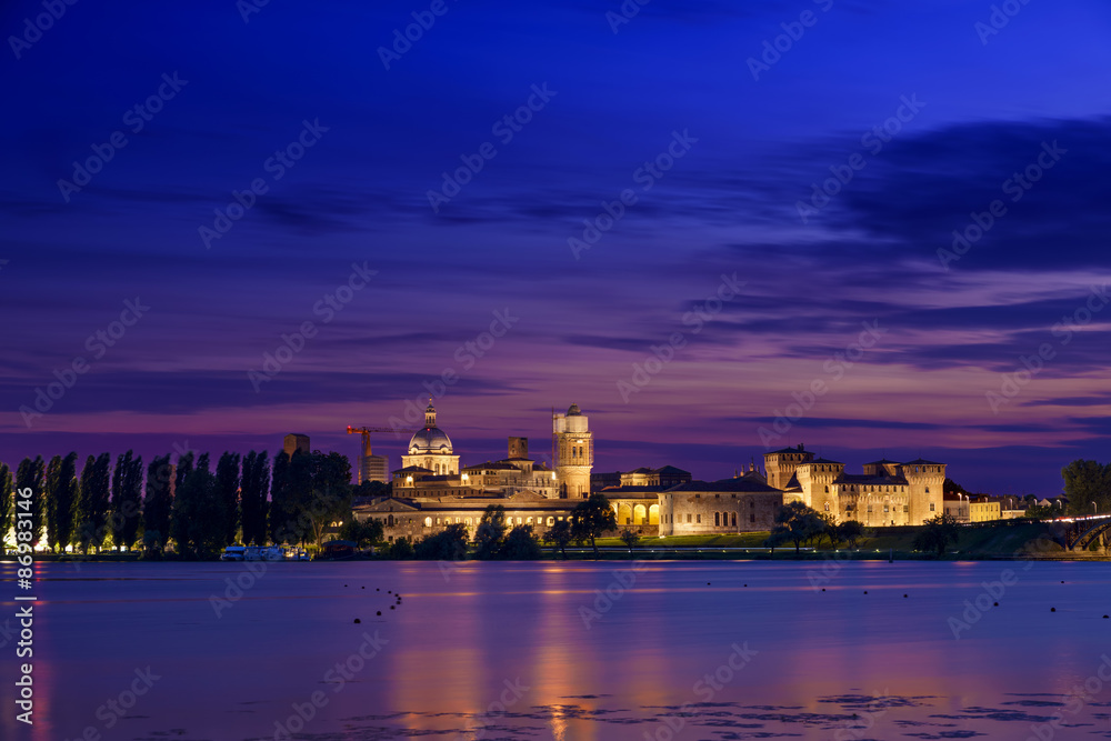Mantua night skyline reflection river