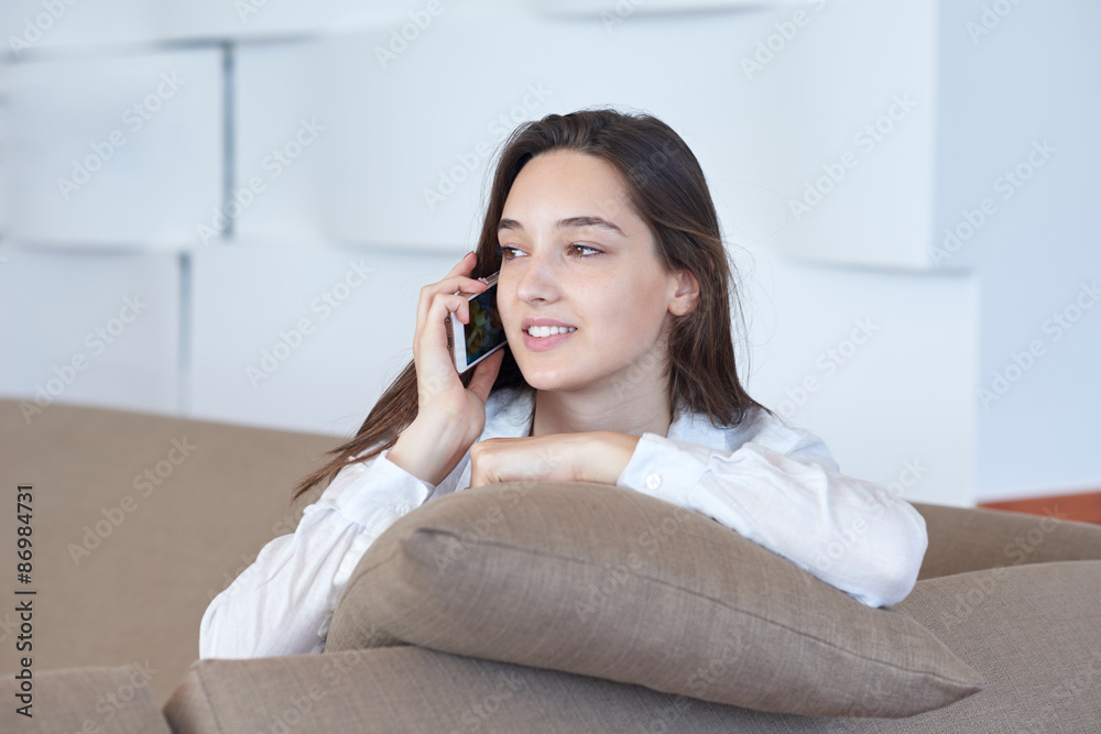 young woman using cellphone at home young woman using cellphone at home