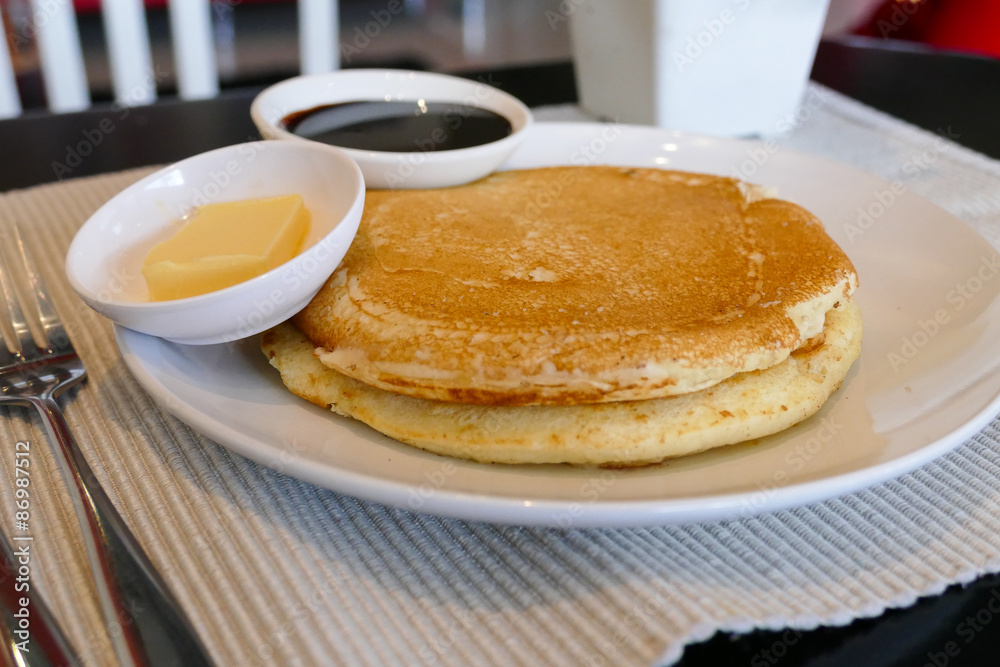 pancake serving with chocolate sauce and butter pancake serving with chocolate sauce and butter