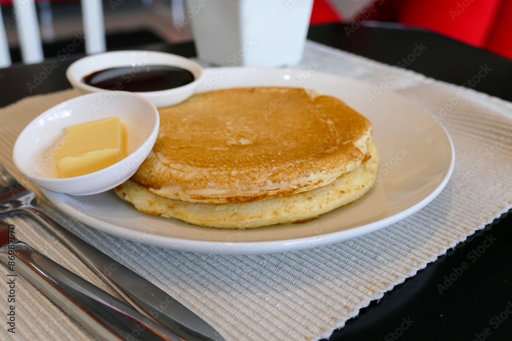 pancake serving with chocolate sauce and butter pancake serving with chocolate sauce and butter