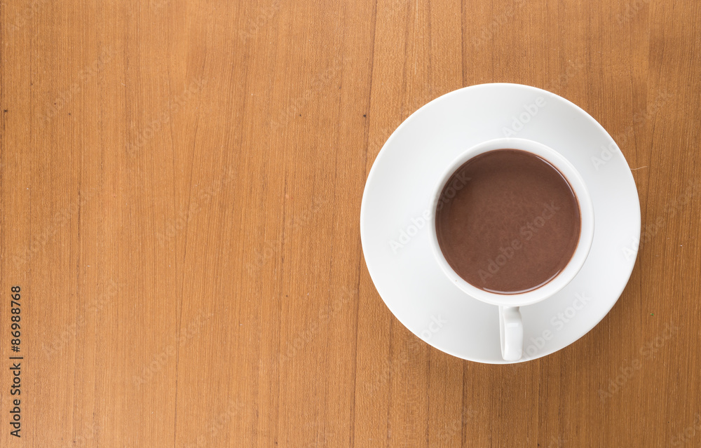 a cup of chocolate on wood table a cup of chocolate on wood table