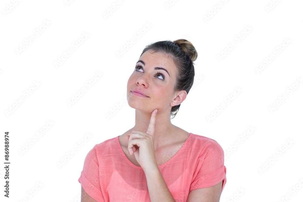 Thoughtful pretty casual brunette standing with hand on chin Thoughtful pretty casual brunette standing with hand on chin