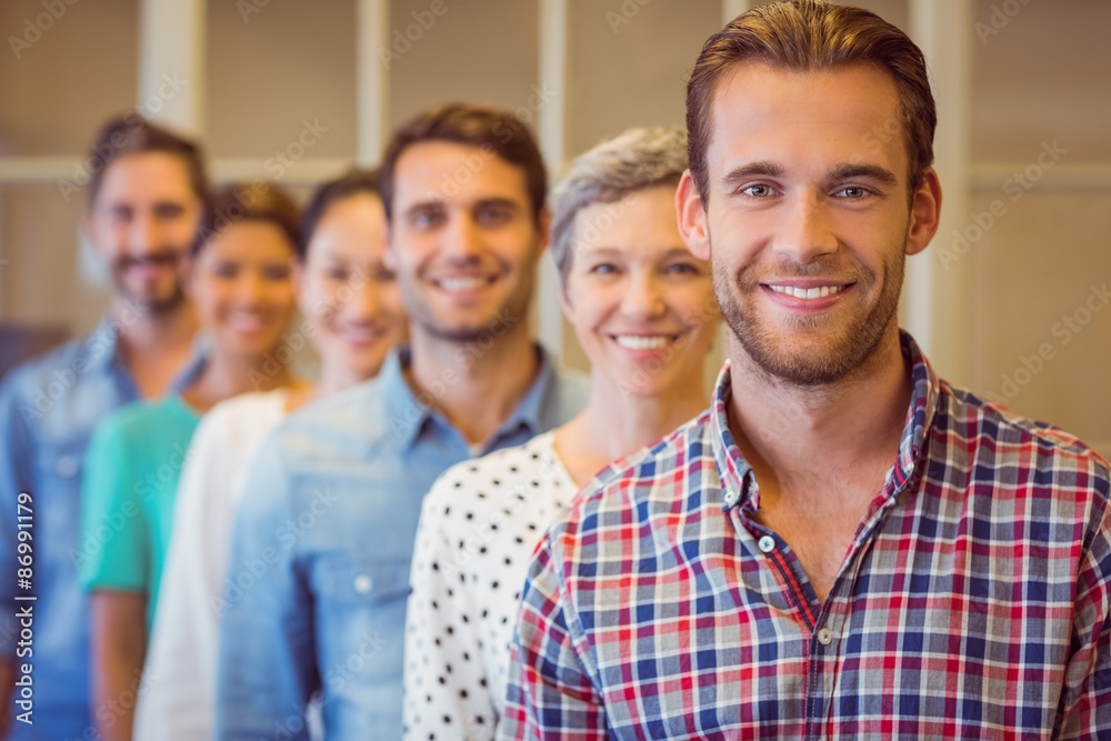 Creative businessman smiling at the camera Creative businessman smiling at the camera
