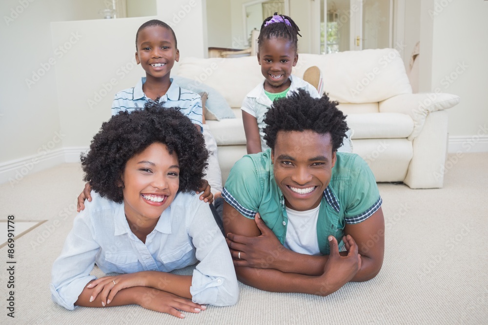 Happy family lying on the floor Happy family lying on the floor