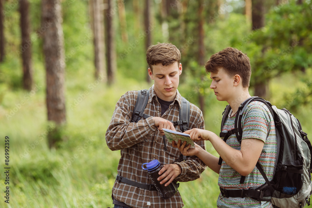 two tourist determine the route map and compass Stock Photo | Adobe Stock