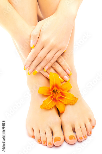 Relaxing pedicure with a orange lily flower