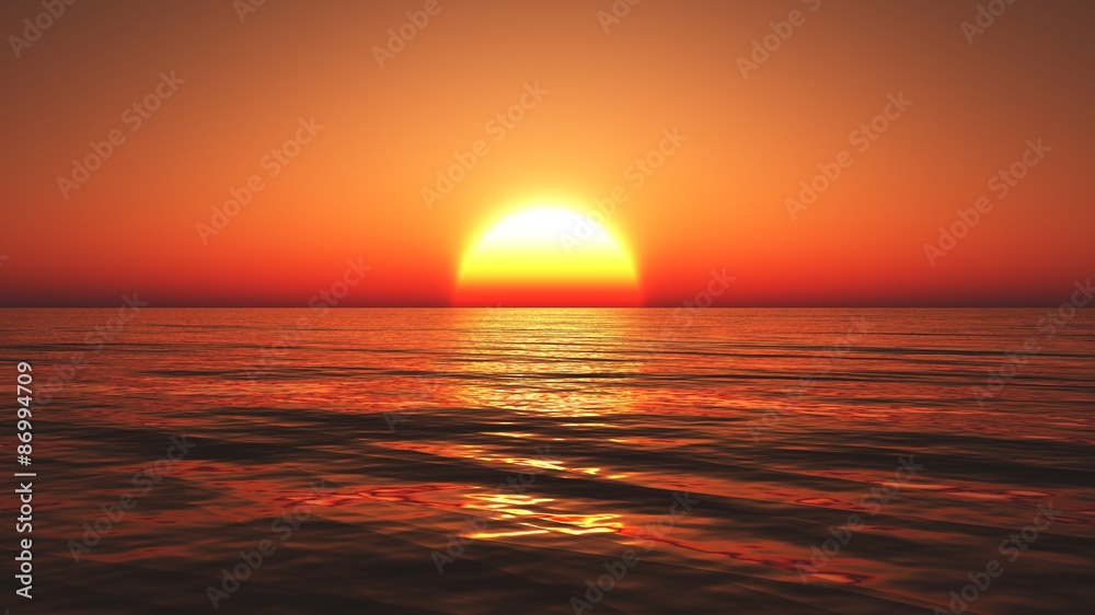 Colorful sunset over the ocean with clear sky and calm sea