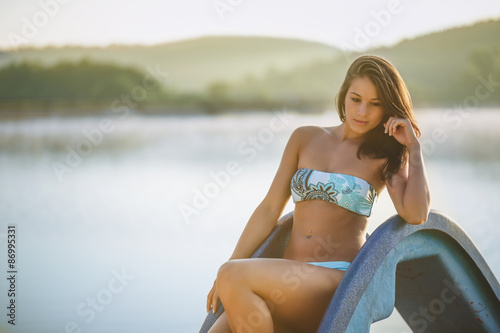Beautiful woman on beach looking at sea water
 photo
