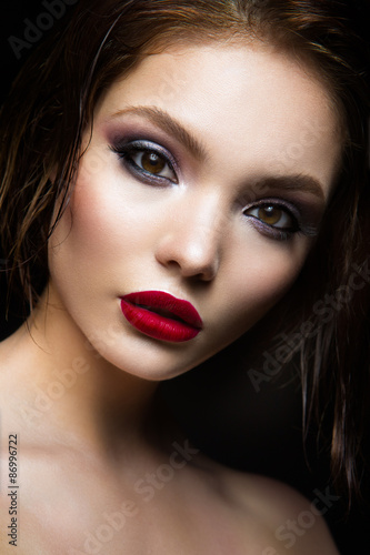 Beautiful young model with red lips