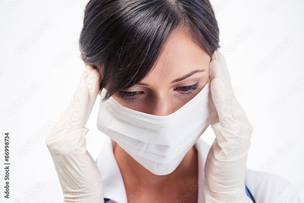 Portrait of a pensive female medical doctor in mask Portrait of a pensive female medical doctor in mask
