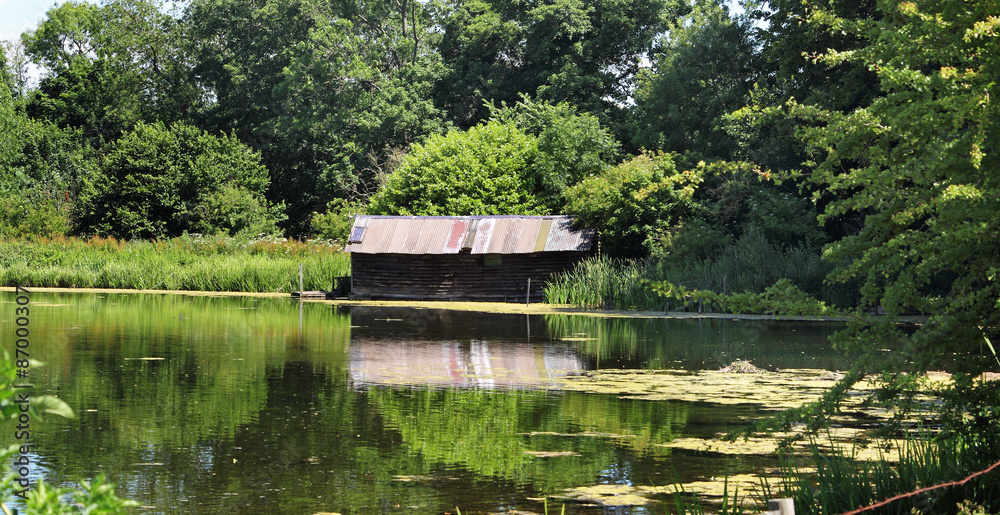 Lake and rustic Boathouse on the river misbourne in Buckinghamshire Lake and rustic Boathouse on the river misbourne in Buckinghamshire