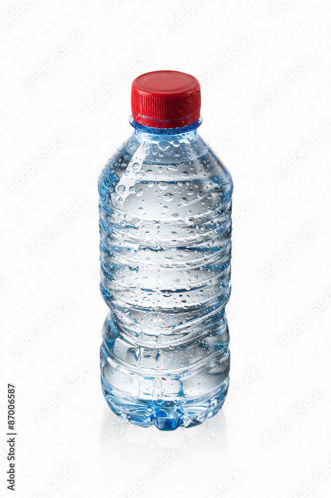 Water. Small plastic water bottle with water drops on white back Water. Small plastic water bottle with water drops on white back