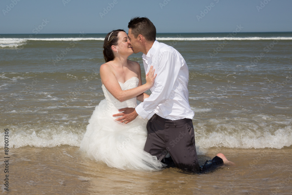 Beautiful couple at the beach happy together Beautiful couple at the beach happy together