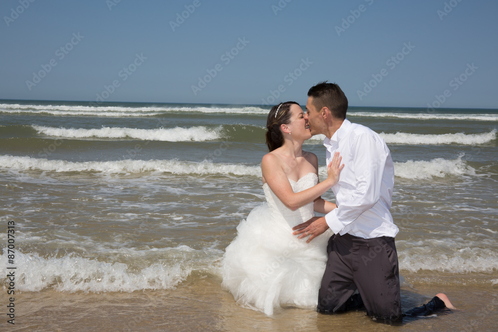 Beautiful couple at the beach happy together Beautiful couple at the beach happy together