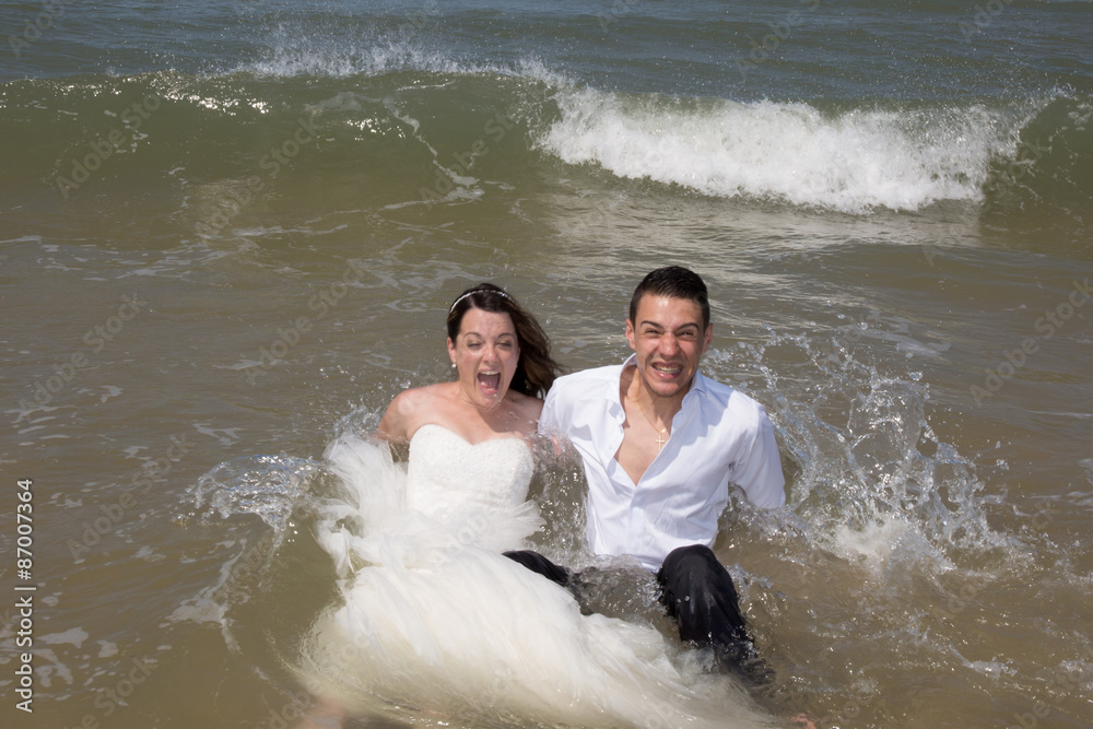 Beautiful couple at the beach happy together Beautiful couple at the beach happy together