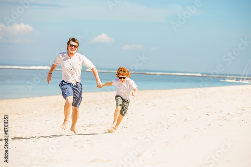 Hipster father with beard and red haired son having happy summer