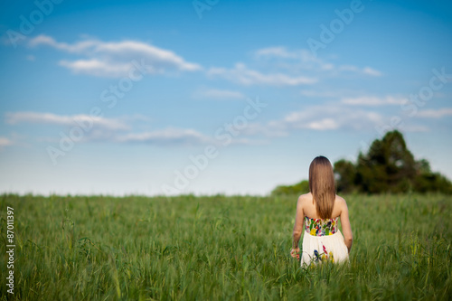 Beautiful young woman in meadow