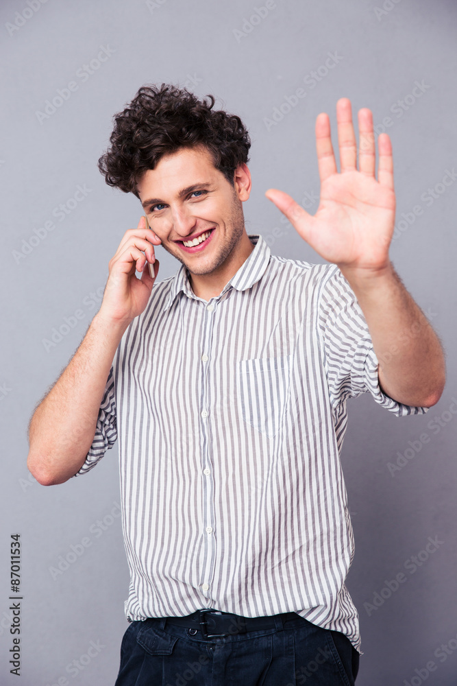 Fototapeta premium Smiling man talking on the phone
