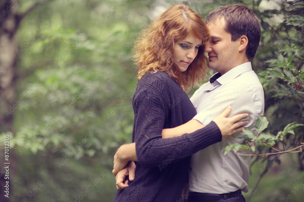 Young couple hugging in the park summer Young couple hugging in the park summer