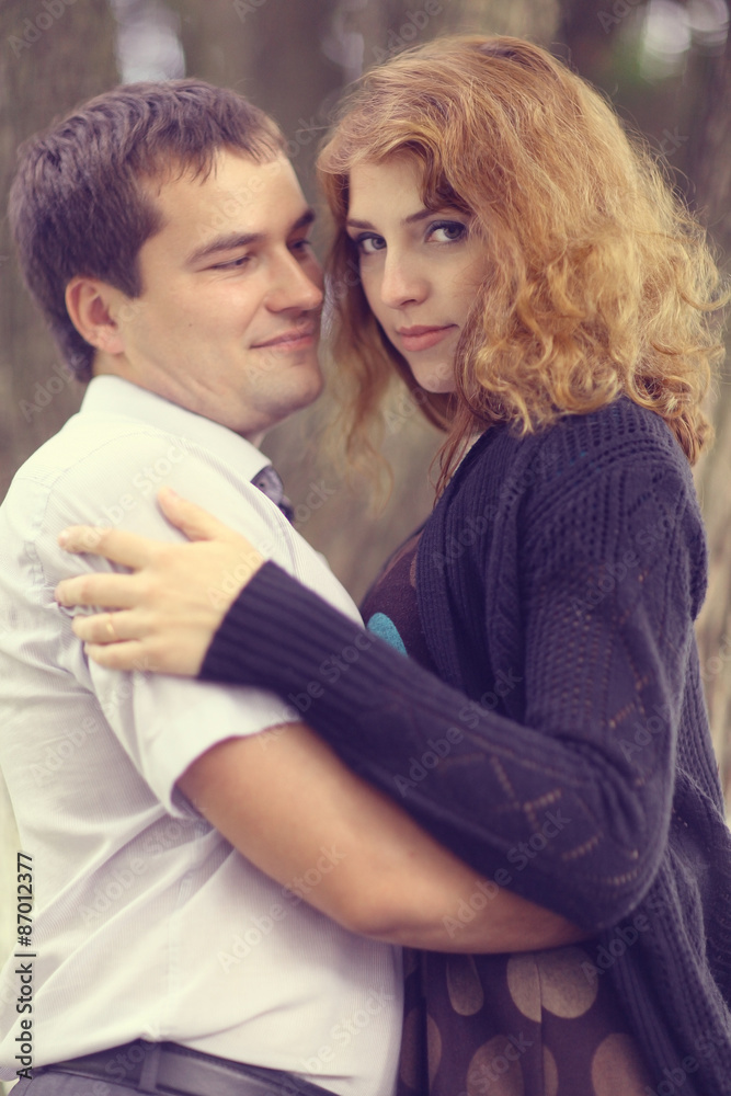 Young couple hugging in the park summer Young couple hugging in the park summer