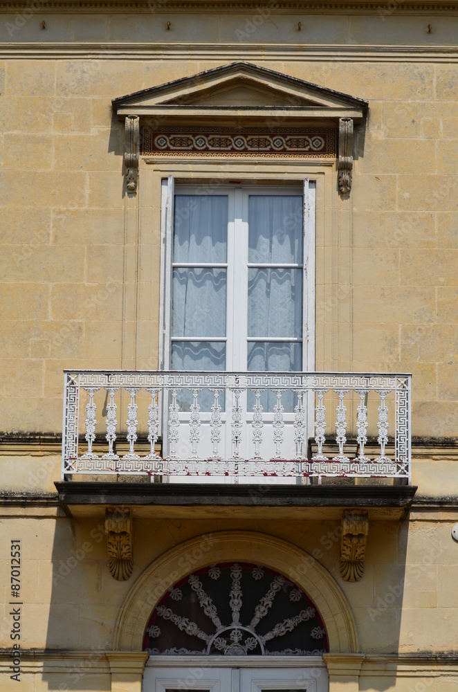 Belle porte-fenêtre avec fronton et balcon. Stock Photo | Adobe Stock