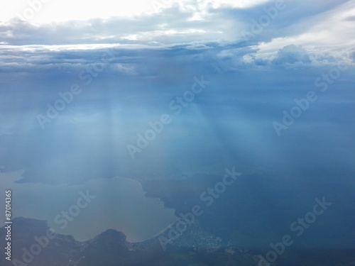 Sky, clouds, rays of Sun, lake under them