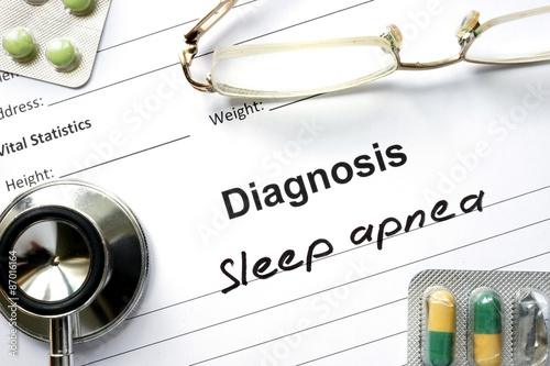Diagnostic form with diagnosis Sleep apnea and pills. photo