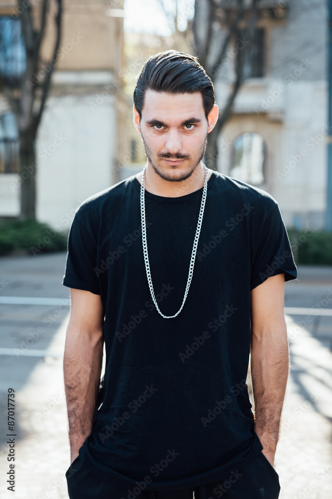 Young italian boy walking in the city Young italian boy walking in the city