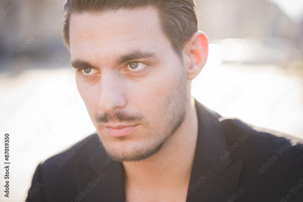 Fototapeta premium Portrait of young man during sunset