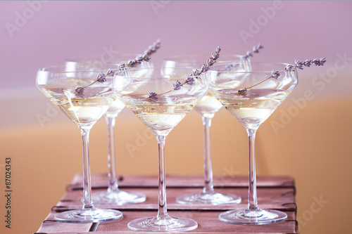 Glasses of white pink champagne decorated with lavender