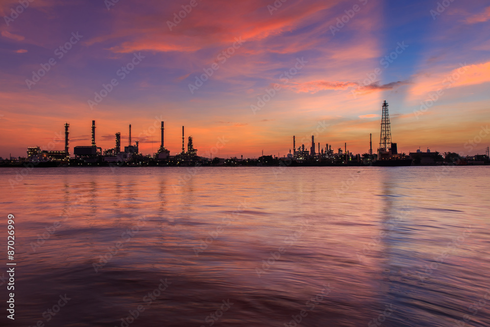 Oil refinery along the river at Dusk (Bangkok, Thailand)