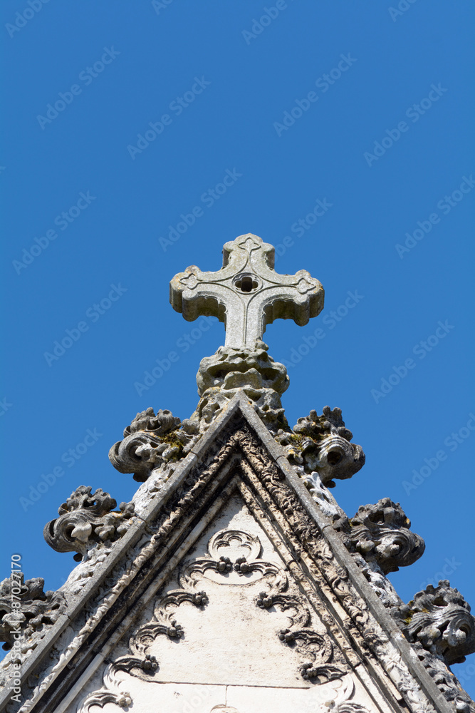 Stone cross on roof of tomb