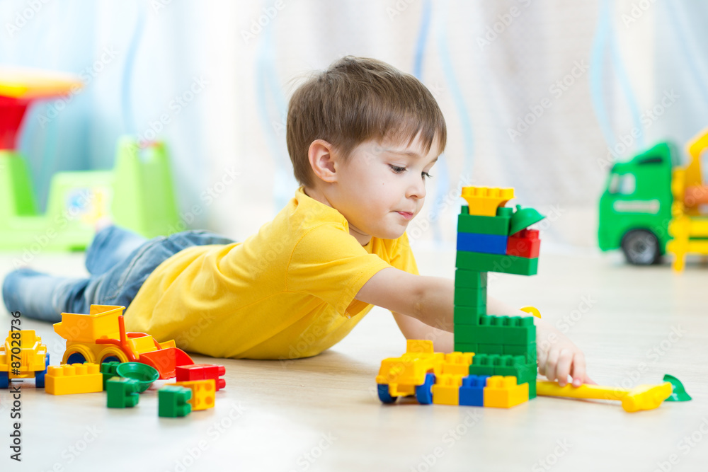 kid playing toy blocks at home kid playing toy blocks at home