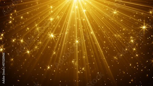 gold light rays and stars abstract background photo