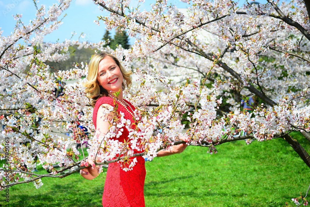 Beautiful female posing in the sakura garden Beautiful female posing in the sakura garden