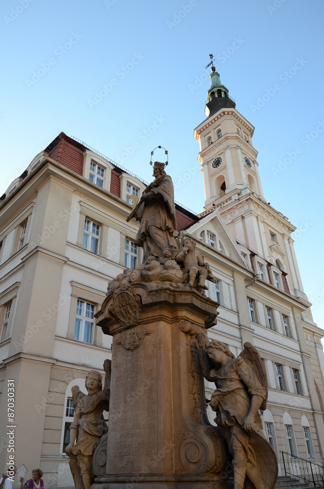 Statue of John of Nepomuk and the town hall in Prudnik