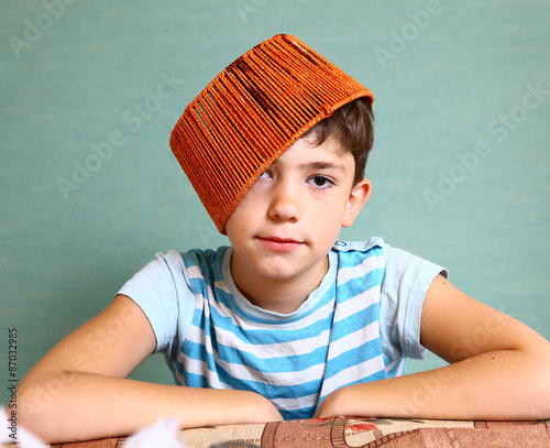 boy with funny headwear as a creative idea photo