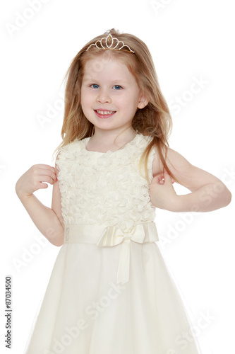 Happy little blonde girl with her hair in braided tiara, long