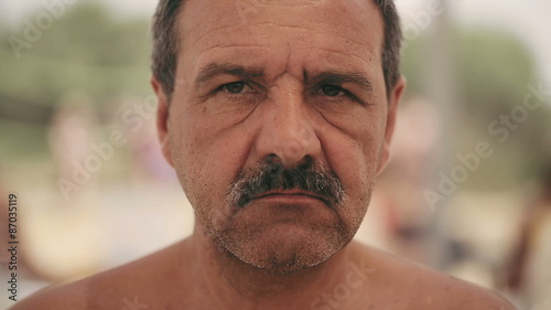 Portrait of an evil man with a mustache, with iron teeth. Close up photo