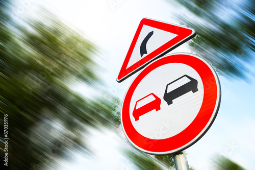 No overtake and three-cornered right turn sign photo