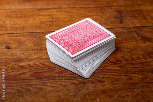 deck of cards on wooden table