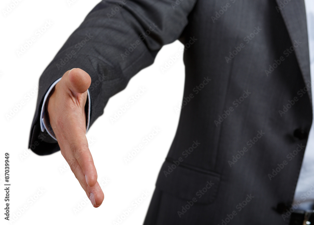 Obraz premium Businessman in suit and tie offering hand to shake