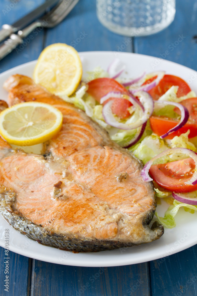 fried salmon with vegetable salad and lemon fried salmon with vegetable salad and lemon
