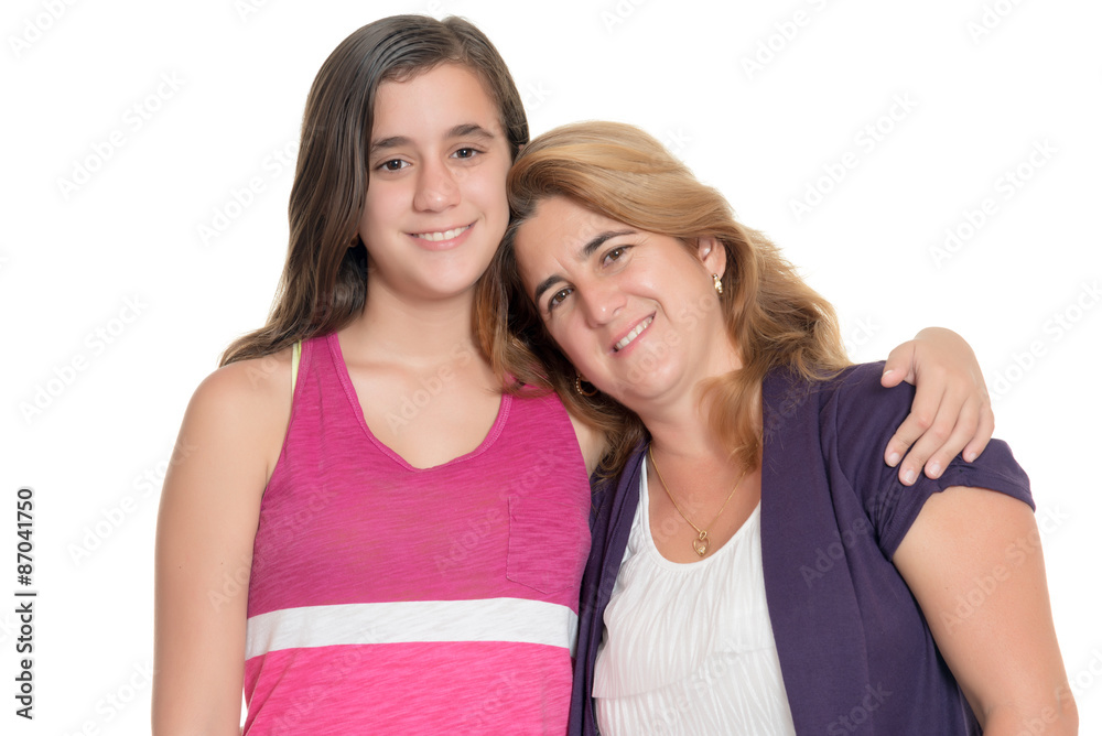 Hispanic teenage girl hugs her mother isolated on white Hispanic teenage girl hugs her mother isolated on white