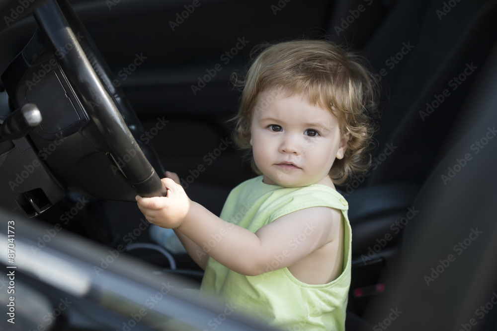 Little male driver in car Little male driver in car